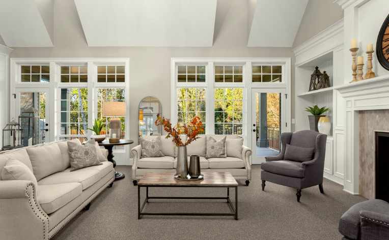 grey carpet in modern living room with fireplace